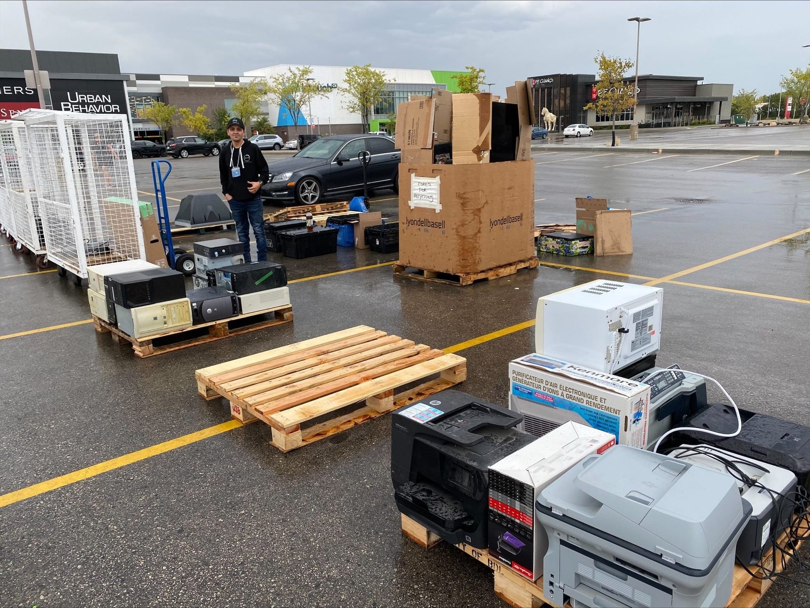 Pallets of collected electronics being loaded at an event