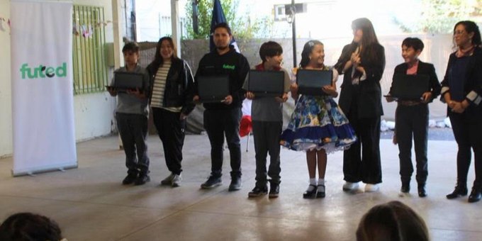Students receiving donated laptops through Futed in Chile